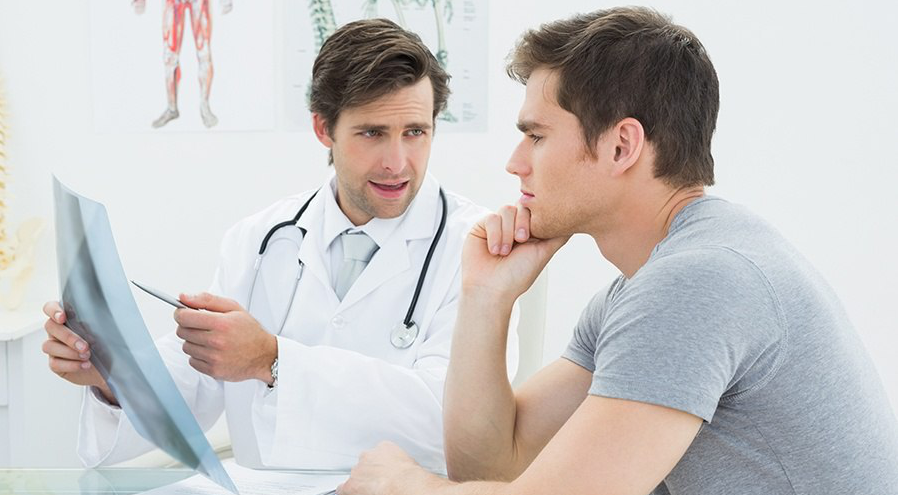 Will Male Enhancement Ever Go Mainstream - Worried man consulting doctor (Shutterstock)