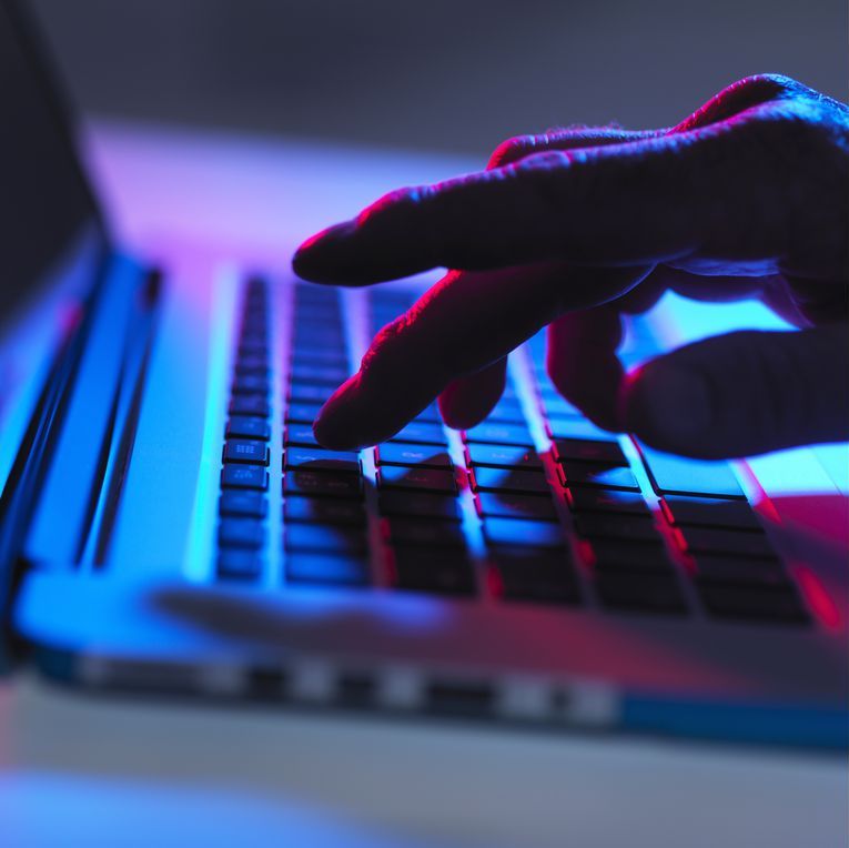 A male hand typing on laptop keyboard (Getty)