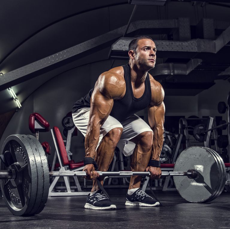 Man doing dead lifts (Getty)