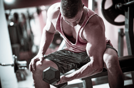 Man exercising in gym (Getty)